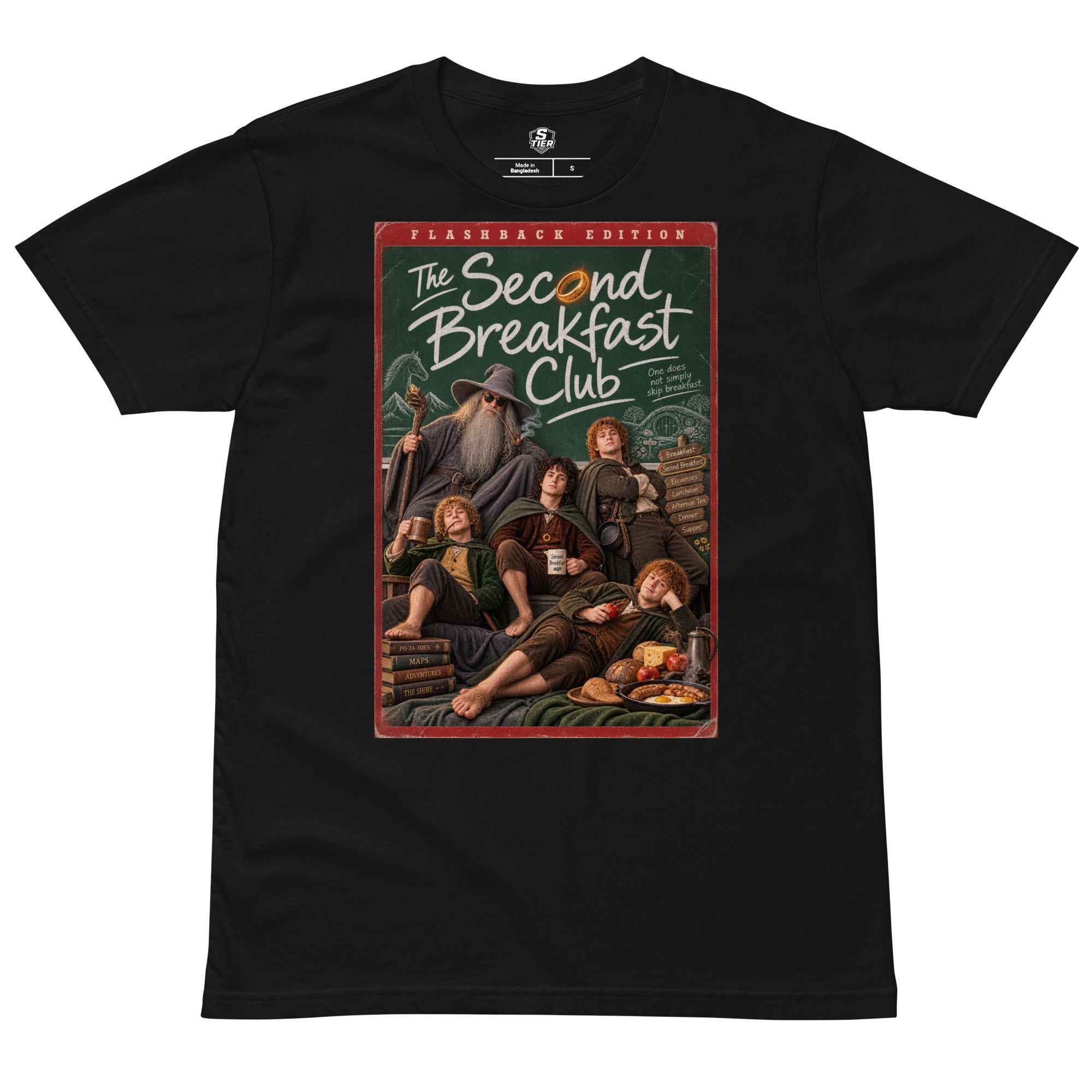 A black short-sleeve lord of the rings t-shirt with a large graphic print on the front featuring character parody of 'The Second Breakfast Club' in a vintage comic-book / dvd video style. The graphic includes the text 'FLASHBACK EDITION' and 'The Second Breakfast Club'.